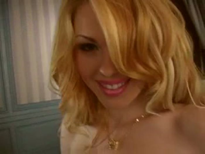 Blonde masturbates pussy